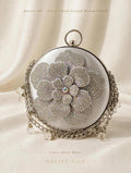 article 07 silver floral crystal round clutch